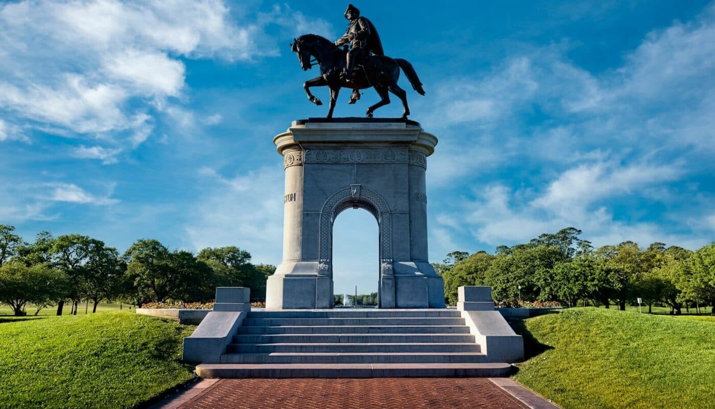black horse statue under blue sky during daytime