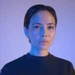 woman wearing black crew-neck shirt