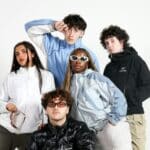 a group of young people posing for a picture