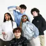 a group of young people posing for a picture