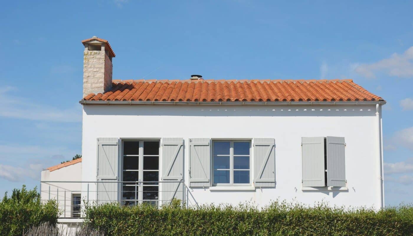 white and orange painted house