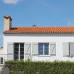 white and orange painted house