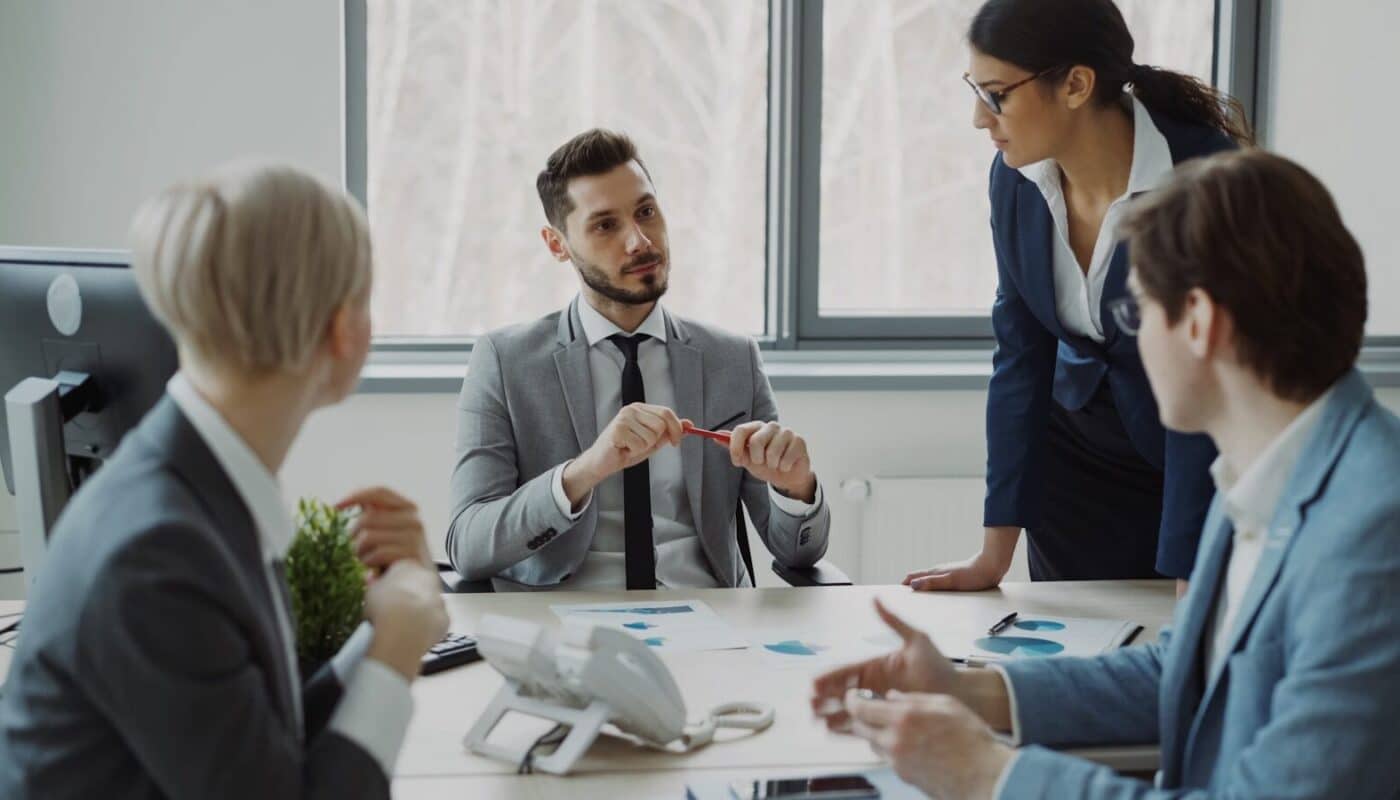 Business professionals collaborating around a conference table.