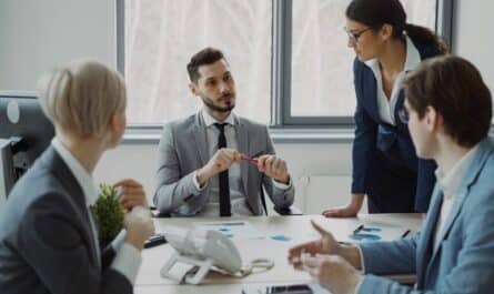 Business professionals collaborating around a conference table.