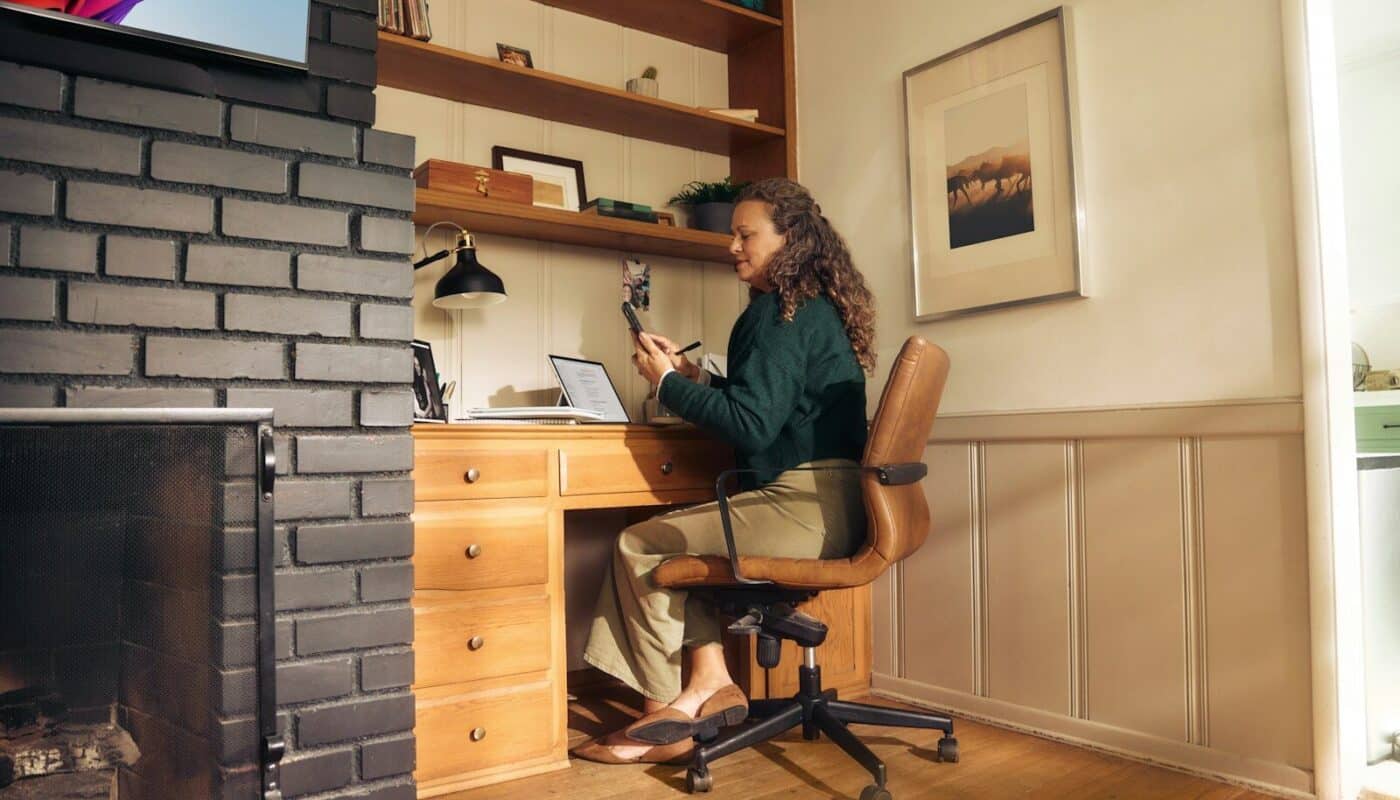 Woman working at a desk in a cozy home office