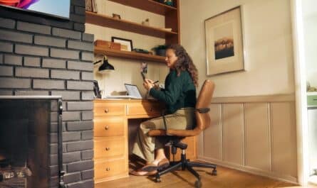Woman working at a desk in a cozy home office